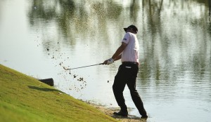 Bill Haas hits from the water on the 17th hole during a playoff against Hunter Mahan in the Tour Championship golf tournament at East Lake Golf Club in Atlanta on Sunday, Sept. 25, 2011. Haas won the tournament on the third playoff hole. (AP Photo/Rainier Ehrhardt)