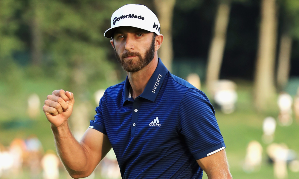Dustin Johnson shows his happy face after sinking a 20-footer for birdie. 